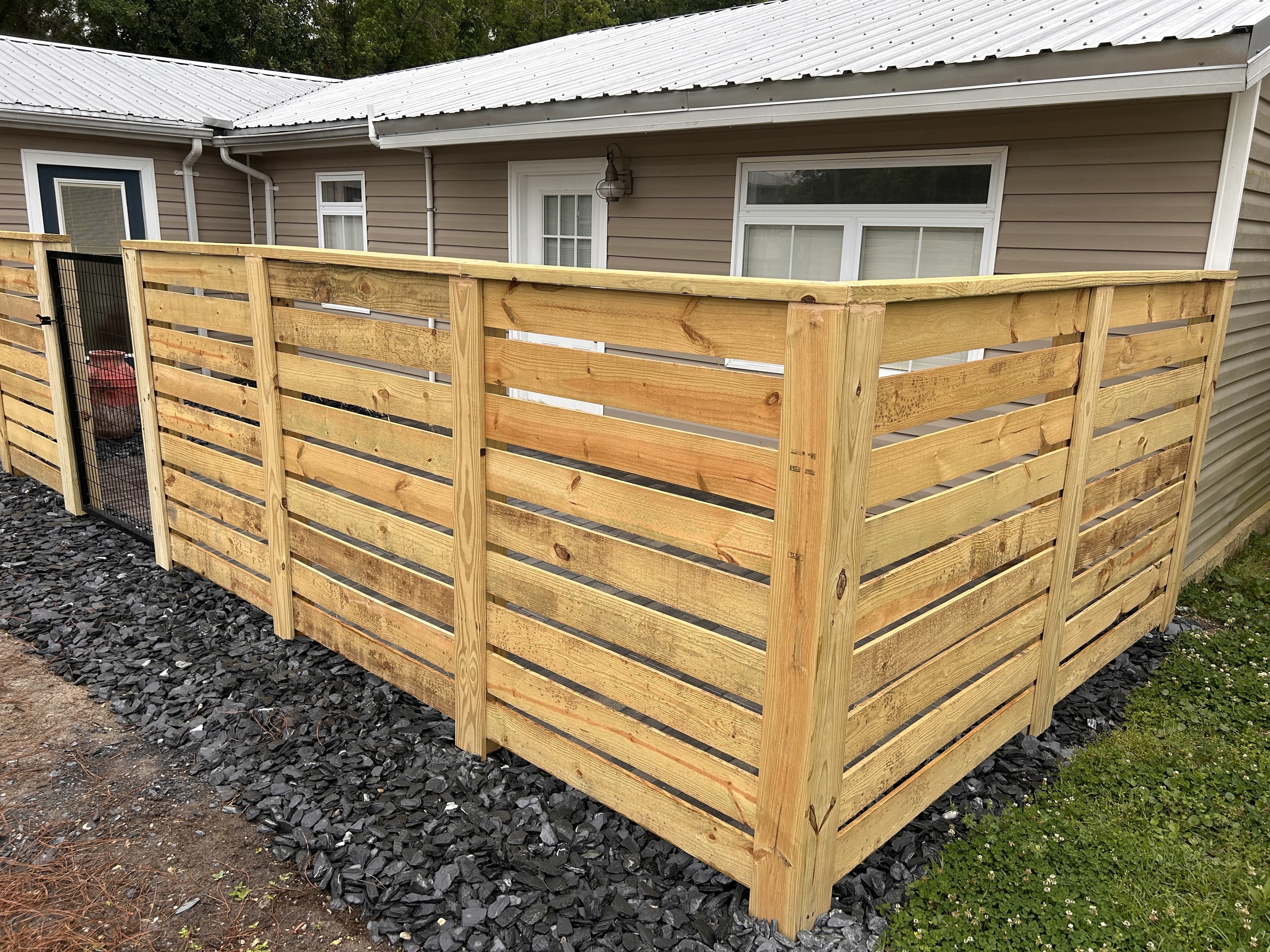 Horizontal picket fence with trim and cap